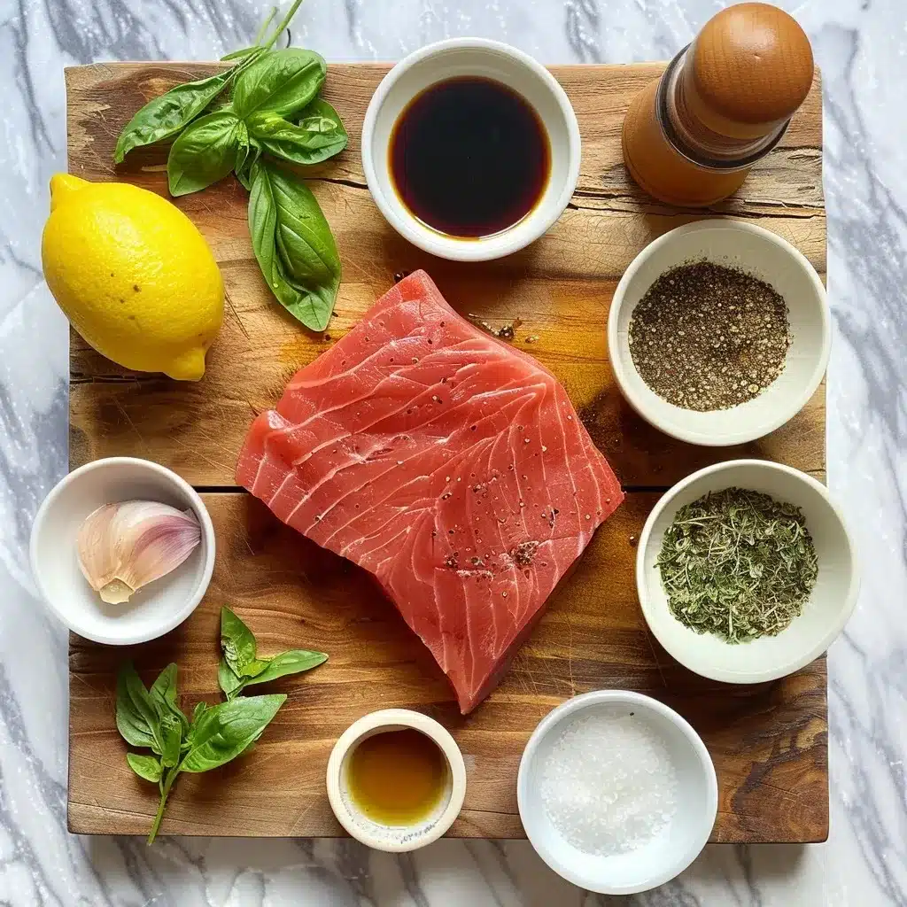 Top-down view of tuna steak and seasonings including olive oil, lemon juice, soy sauce, garlic powder, dried herbs, salt, and pepper arranged on a wooden board.