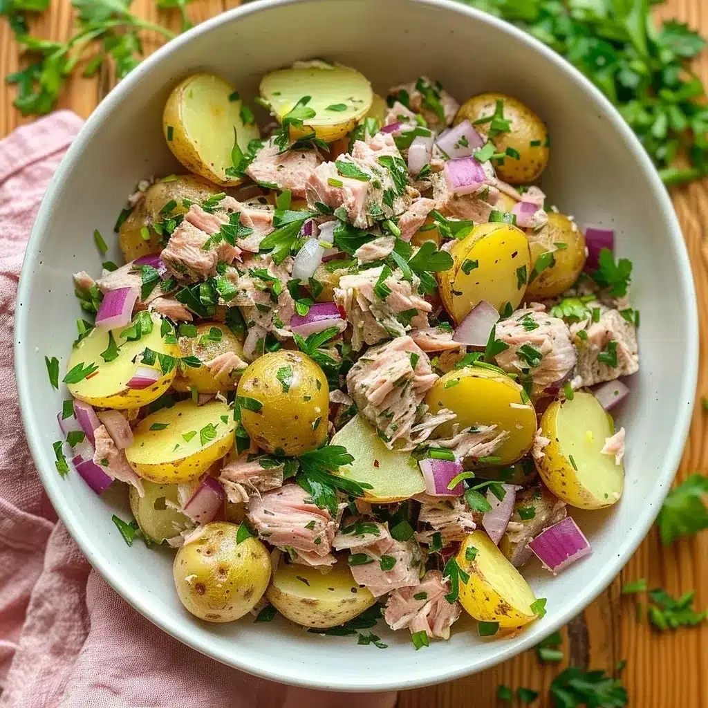 Potato tuna salad recipe with lemon, capers, and herbs in a ceramic bowl