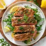 Tasty-style seared tuna steak with pepper and herbs, served on arugula with fresh dill, plated for a modern recipe video look.